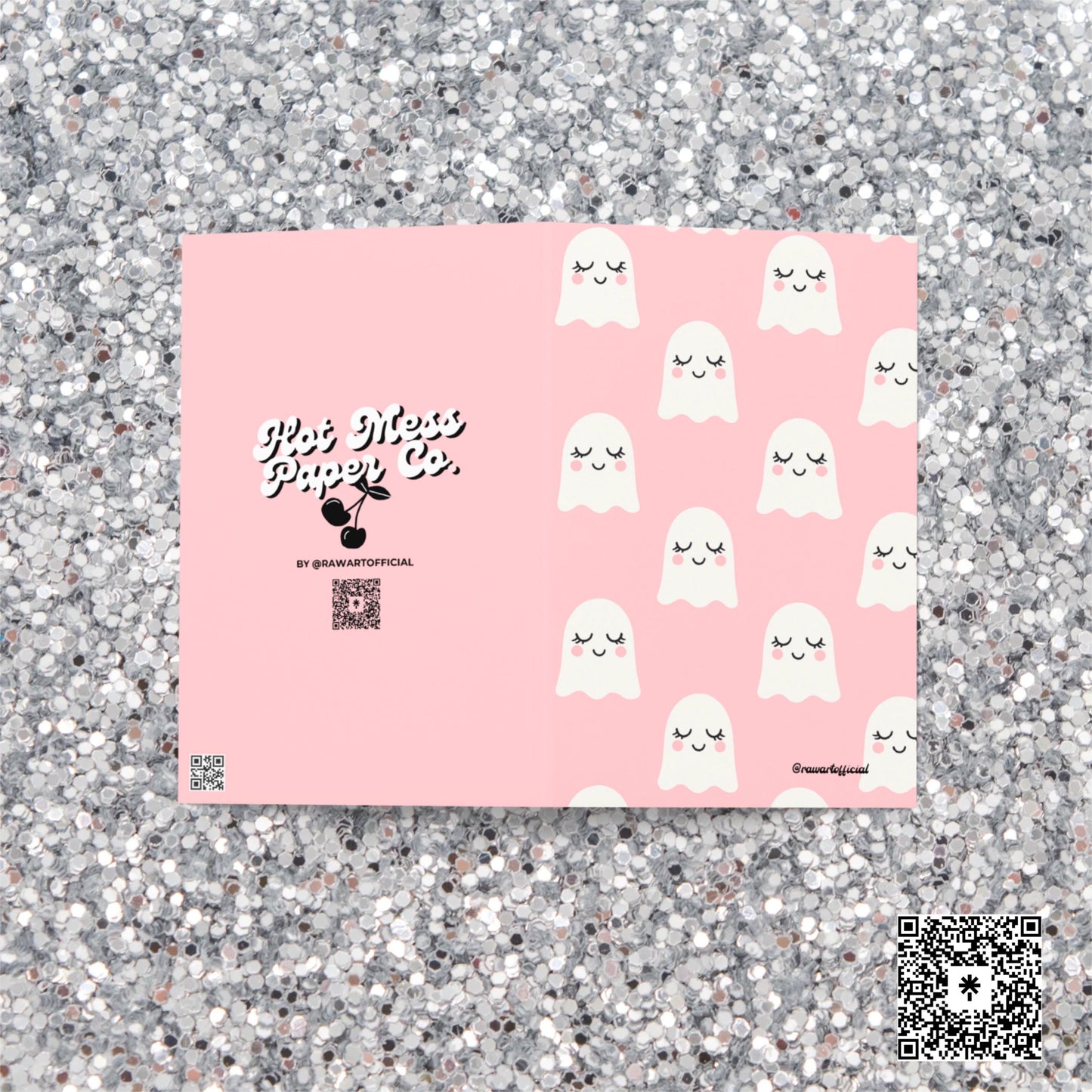 Pink greeting card with repeating white smiling ghosts featuring rosy cheeks and sleepy eyes in kawaii pastel style.