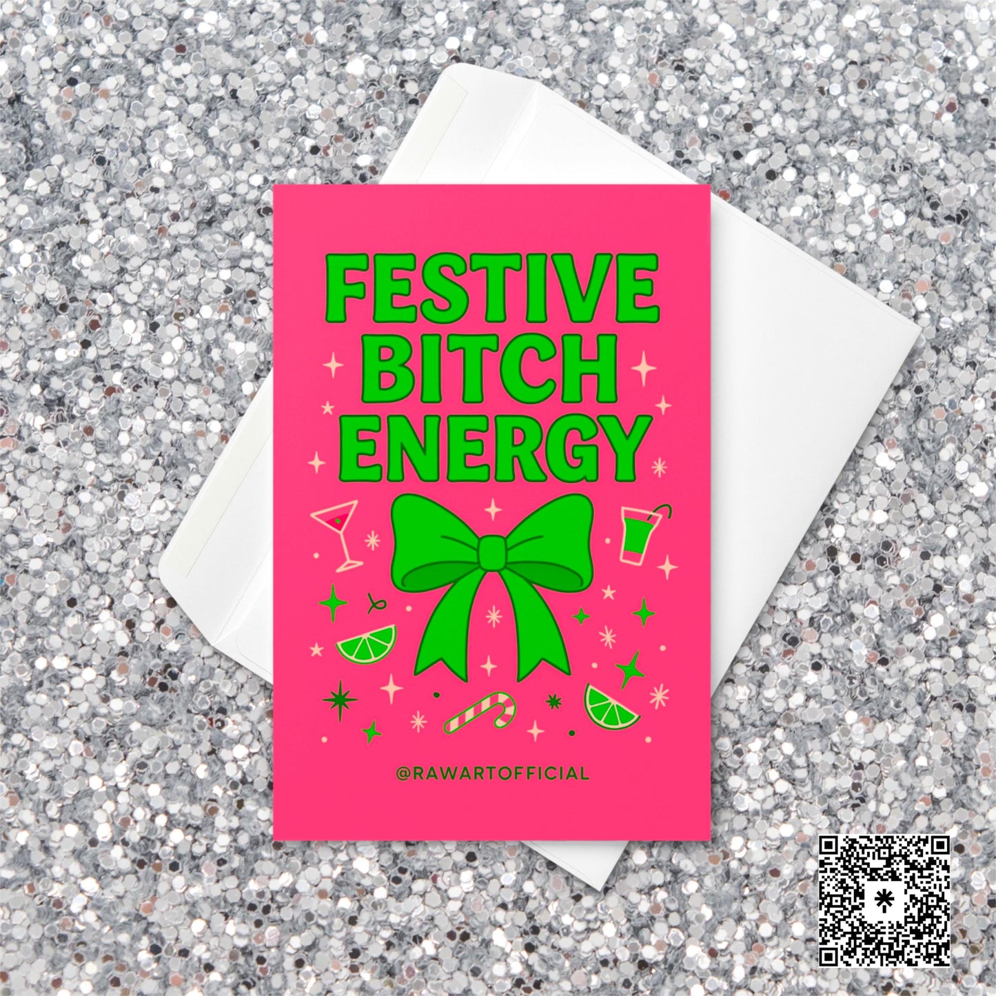 Bright pink Christmas card with large green bow surrounded by limes, candy canes, and martini glasses. Text reads “Festive Bitch Energy” with playful retro holiday vibes.
