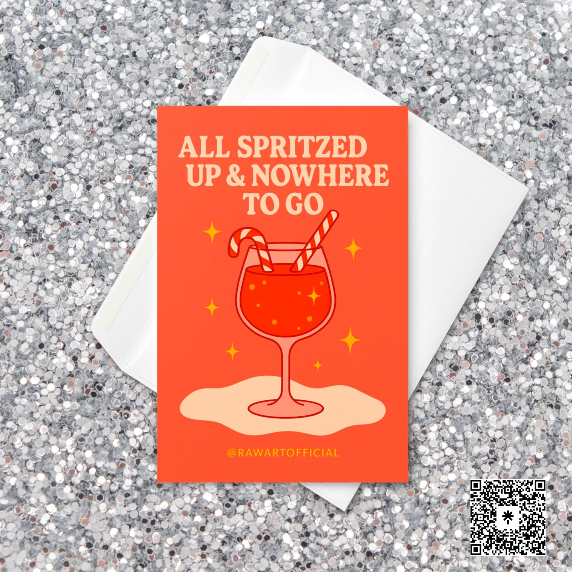 Retro orange Christmas card featuring a glass of spritz with two candy cane straws and sparkly golden stars, with the phrase “All Spritzed Up & Nowhere to Go” in cream-colored text.