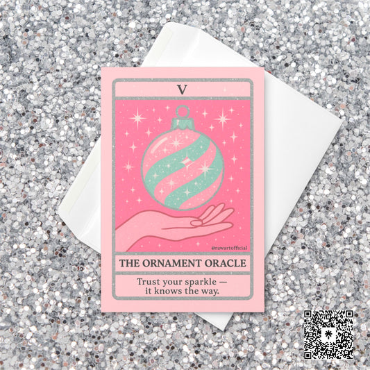 Pastel pink and mint Christmas tarot-style card featuring a sparkly striped ornament floating above a hand, titled “The Ornament Oracle” with the phrase “Trust your sparkle — it knows the way.”