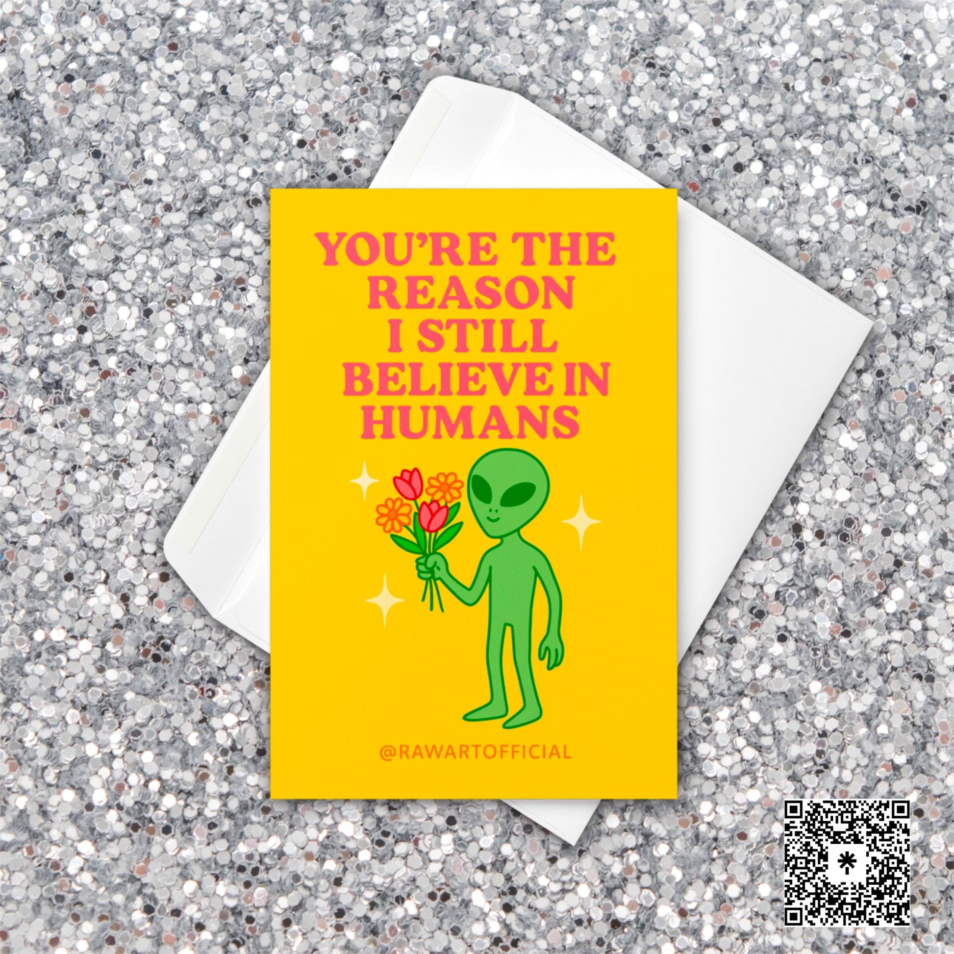 Retro alien greeting card holding flowers with text “You’re the reason I still believe in humans.”