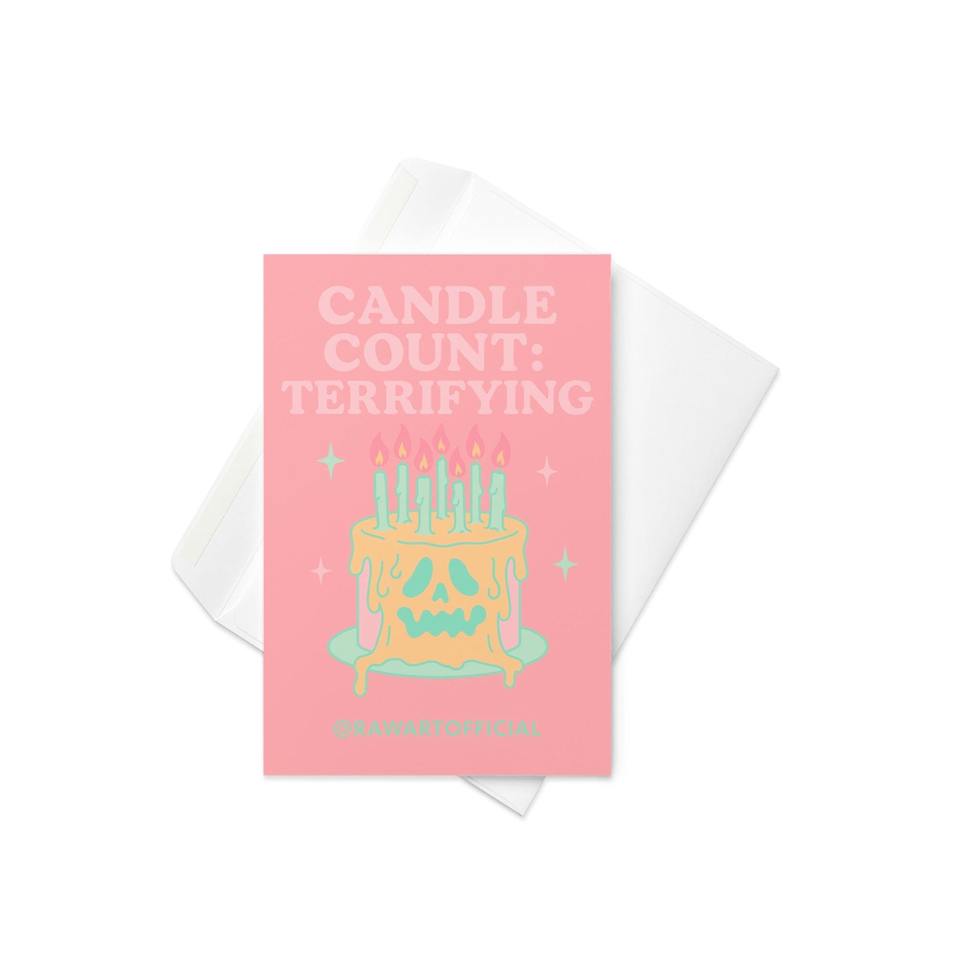 Pink greeting card that reads ‘CANDLE COUNT: TERRIFYING’ above a melting skull-faced birthday cake with many lit mint candles and sparkles—spooky, pastel-goth vibe.