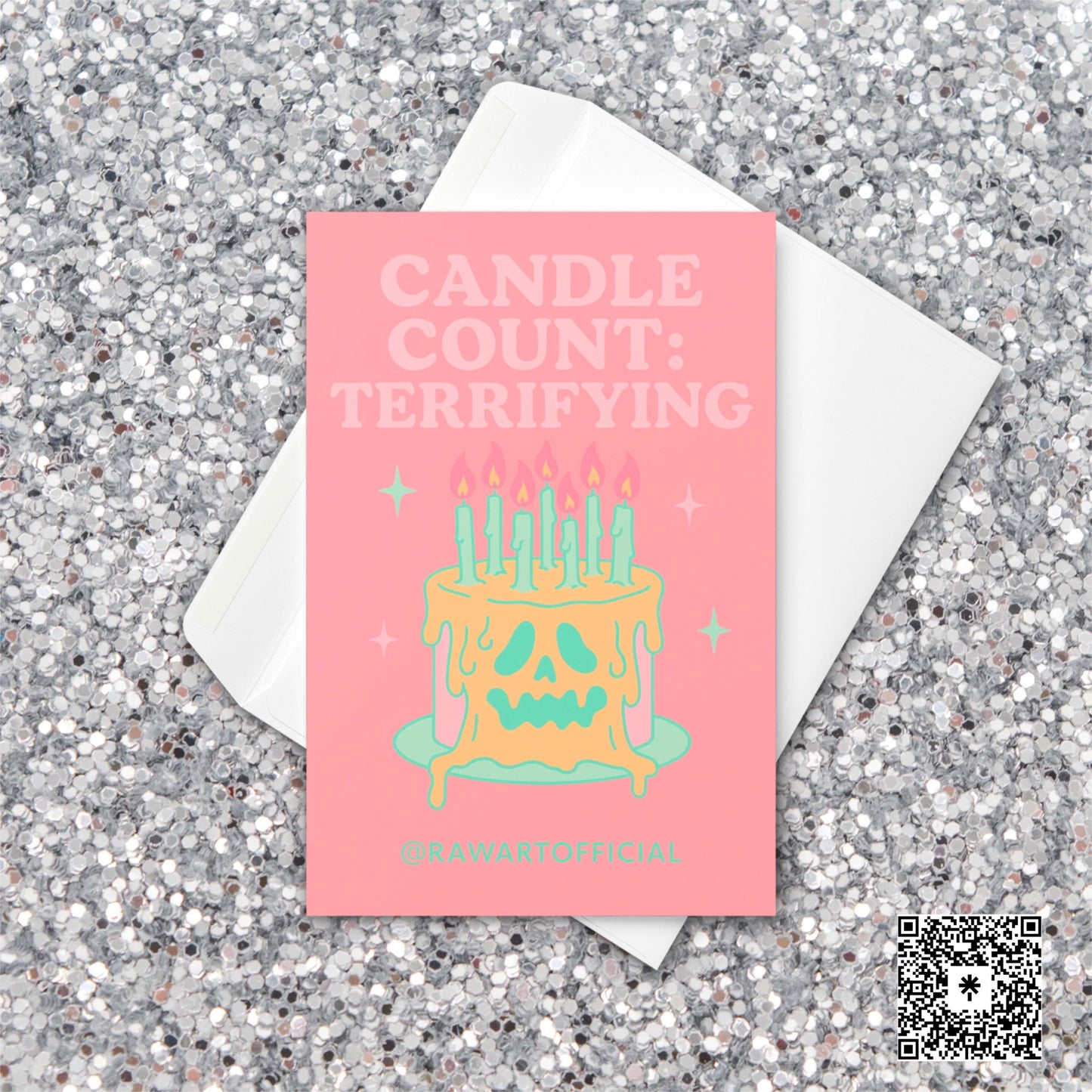 Pink greeting card that reads ‘CANDLE COUNT: TERRIFYING’ above a melting skull-faced birthday cake with many lit mint candles and sparkles—spooky, pastel-goth vibe.