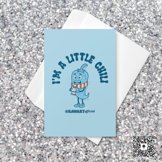 Light blue Christmas card featuring a cartoon chili pepper in a striped scarf with text reading “I’m a Little Chili.”
