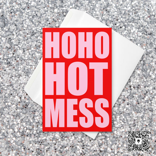 Bright red and pink Christmas card with bold block text reading “Ho Ho Hot Mess” on a glitter background.