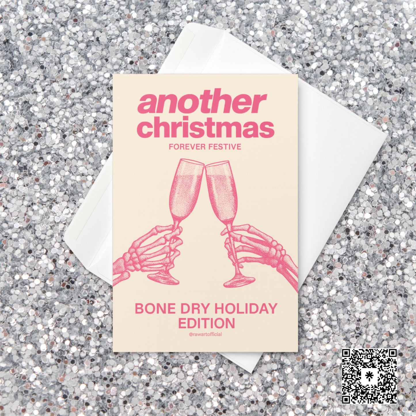 Minimalist Christmas card with pink text reading “Another Christmas — Bone Dry Holiday Edition” above two skeleton hands clinking champagne glasses.