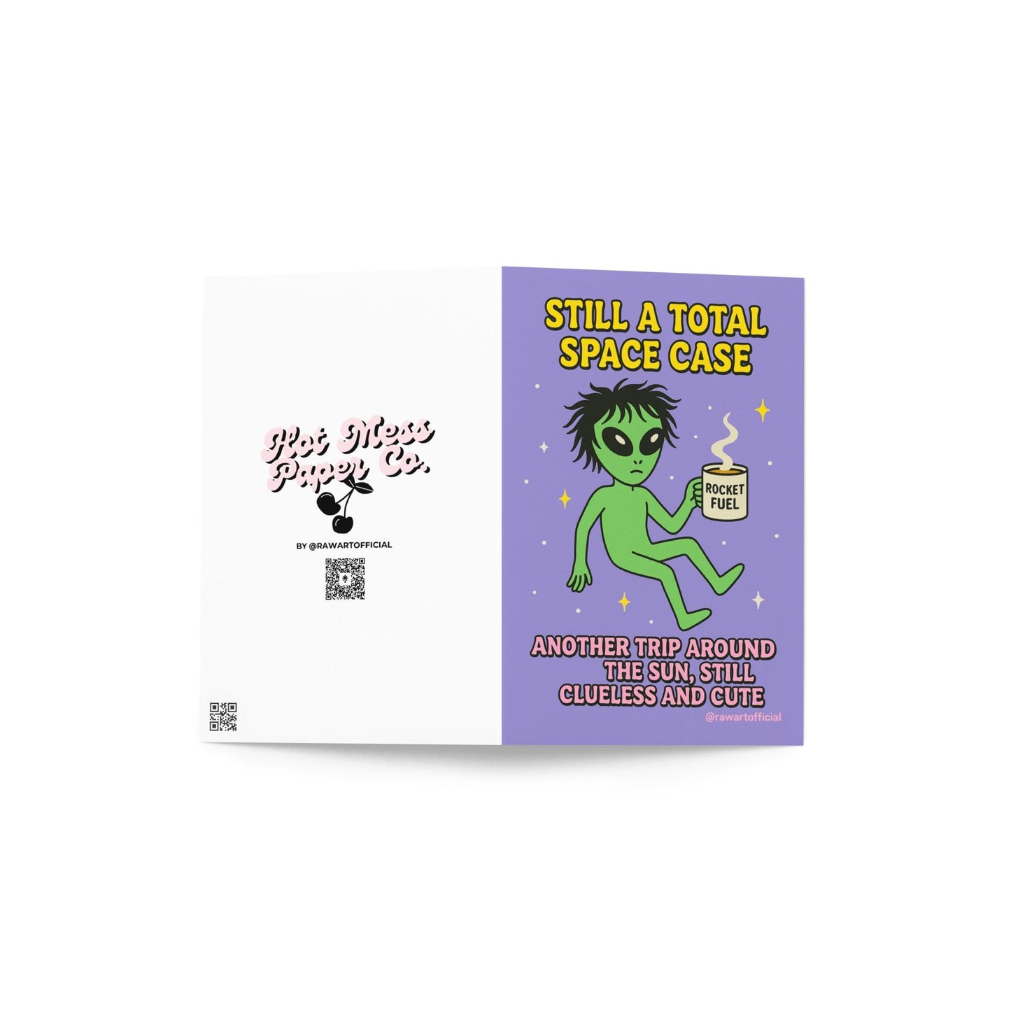 Green alien holding a coffee mug labeled “Rocket Fuel” floating in space with text “Still a Total Space Case.”