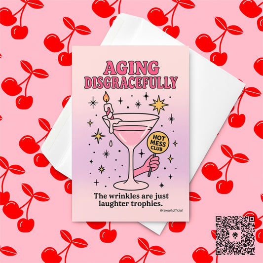 Pink martini glass with candle and “Hot Mess Club” sign surrounded by stars, text reads “Aging Disgracefully — The wrinkles are just laughter trophies.”