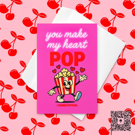 Retro cartoon popcorn box with hearts and neon pink text reads “You Make My Heart Pop” on a hot-pink background.