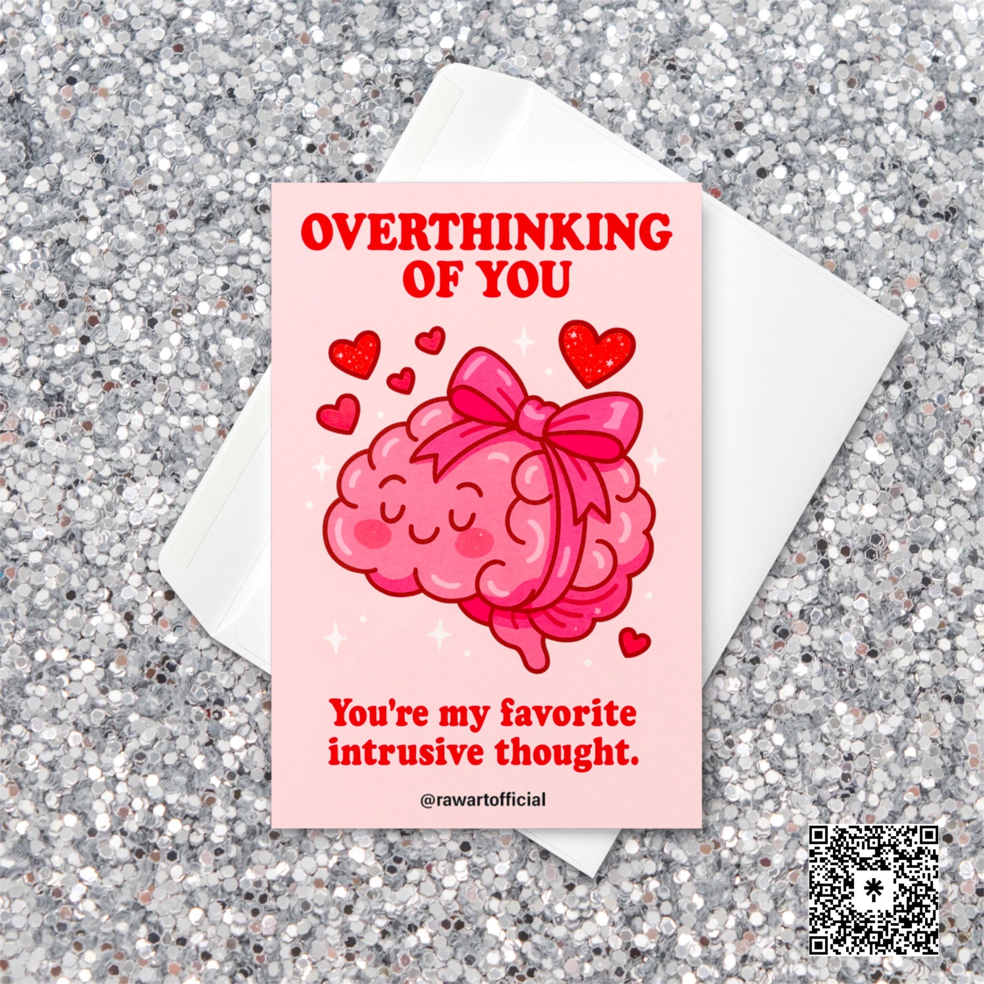 Cute pink Valentine card with a cartoon brain tied in a bow surrounded by hearts, captioned “Overthinking of You – You’re my favorite intrusive thought.”