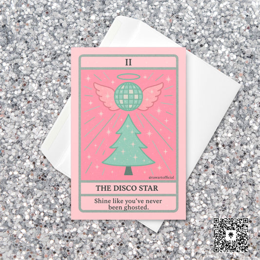 Pastel pink and mint Christmas tarot-style card featuring a sparkly disco ball with angel wings above a Christmas tree, with text reading “The Disco Star – Shine like you’ve never been ghosted.”