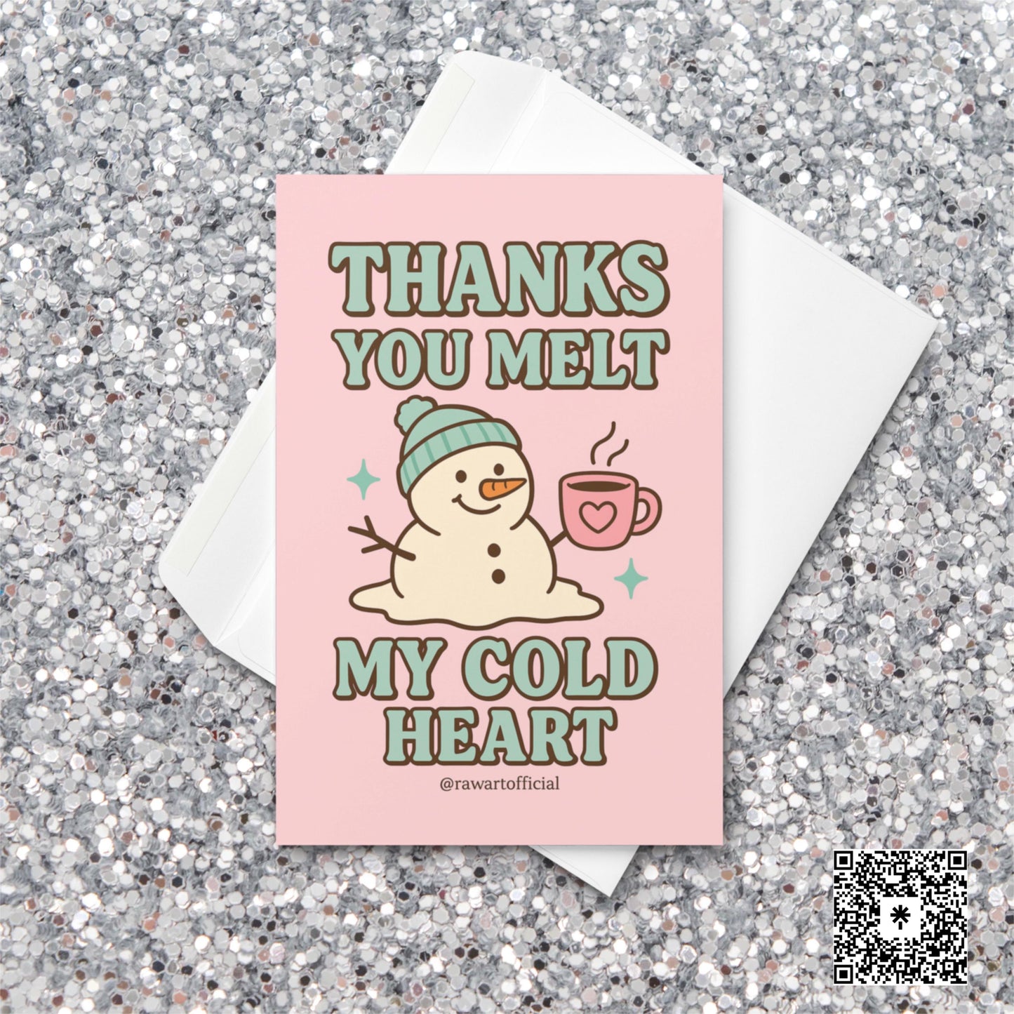 Pink greeting card with melting snowman in a teal hat holding a heart mug, text reads “Thanks You Melt My Cold Heart.”