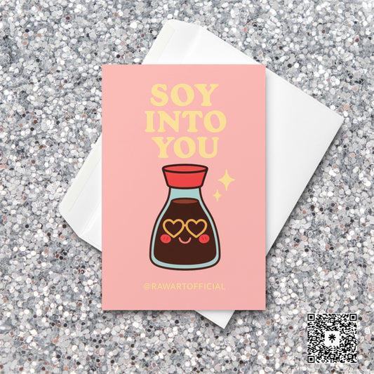 Cute soy sauce bottle with heart-shaped sunglasses under text reading “Soy Into You” on pink background.