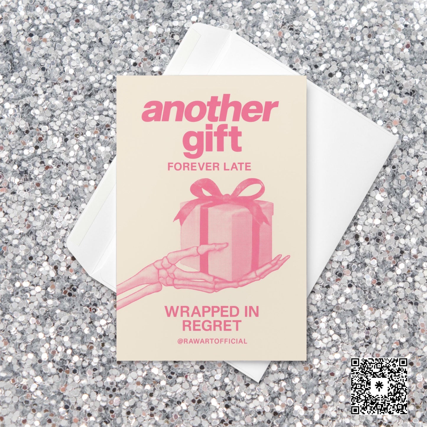 Minimalist pink Christmas card featuring a skeleton hand holding a wrapped present with text reading “Another Gift — Forever Late, Wrapped in Regret.”