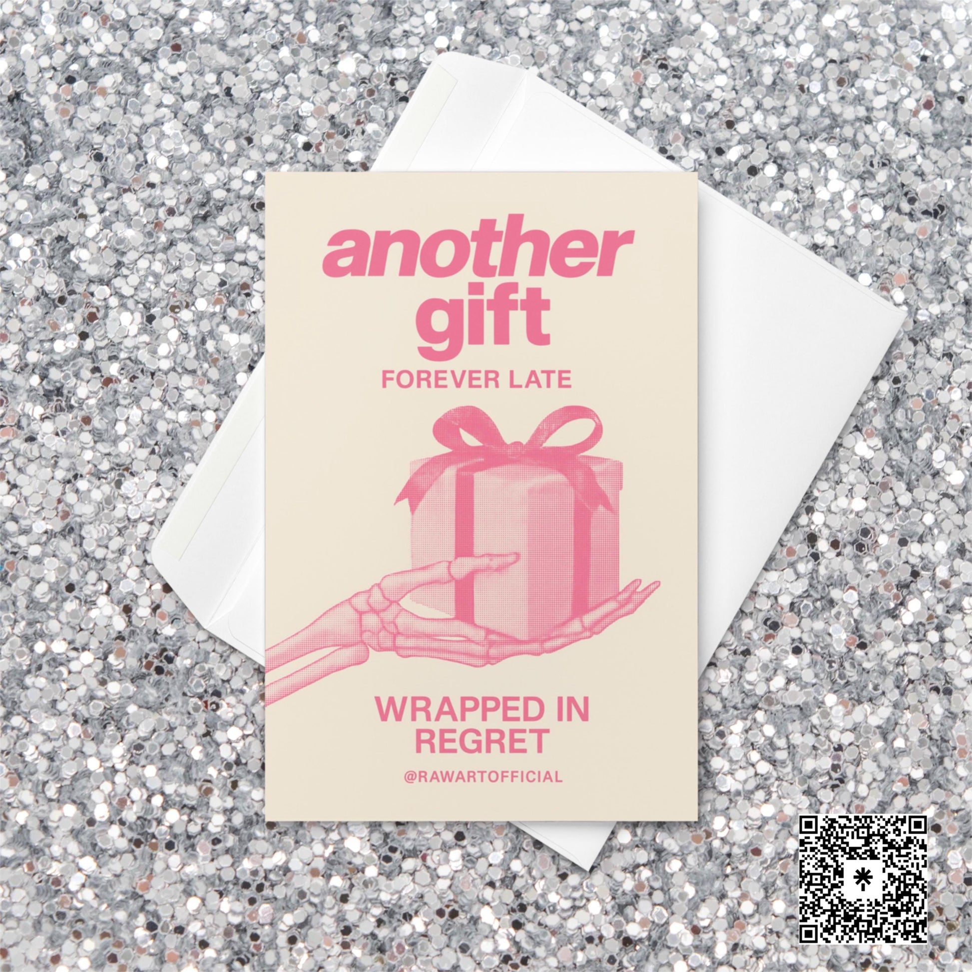 Minimalist pink Christmas card featuring a skeleton hand holding a wrapped present with text reading “Another Gift — Forever Late, Wrapped in Regret.”