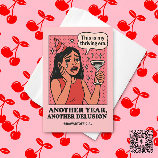 Crying cartoon woman in a red party hat holding a martini glass, saying “This is my thriving era,” with text “Another Year, Another Delusion” below.