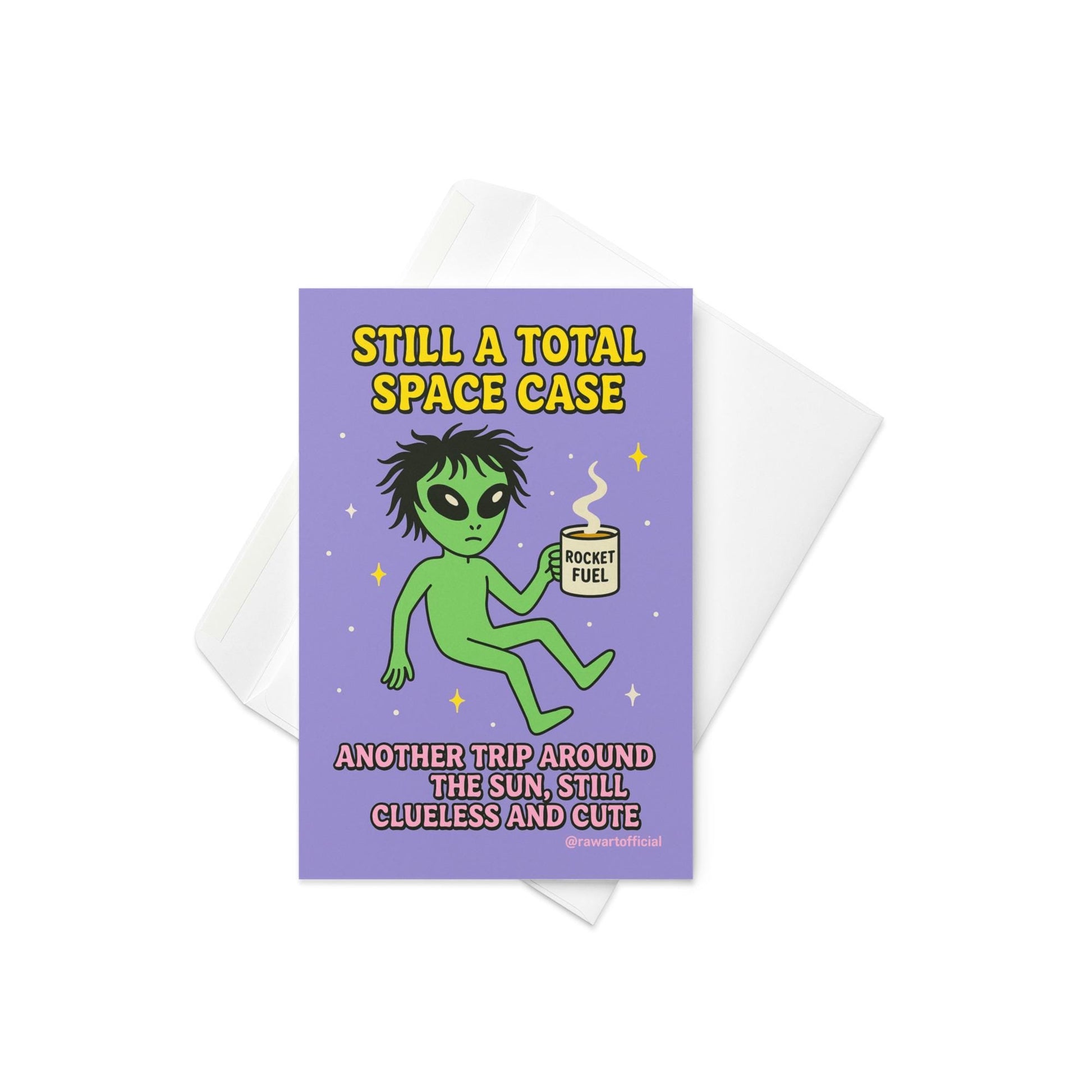 Green alien holding a coffee mug labeled “Rocket Fuel” floating in space with text “Still a Total Space Case.”