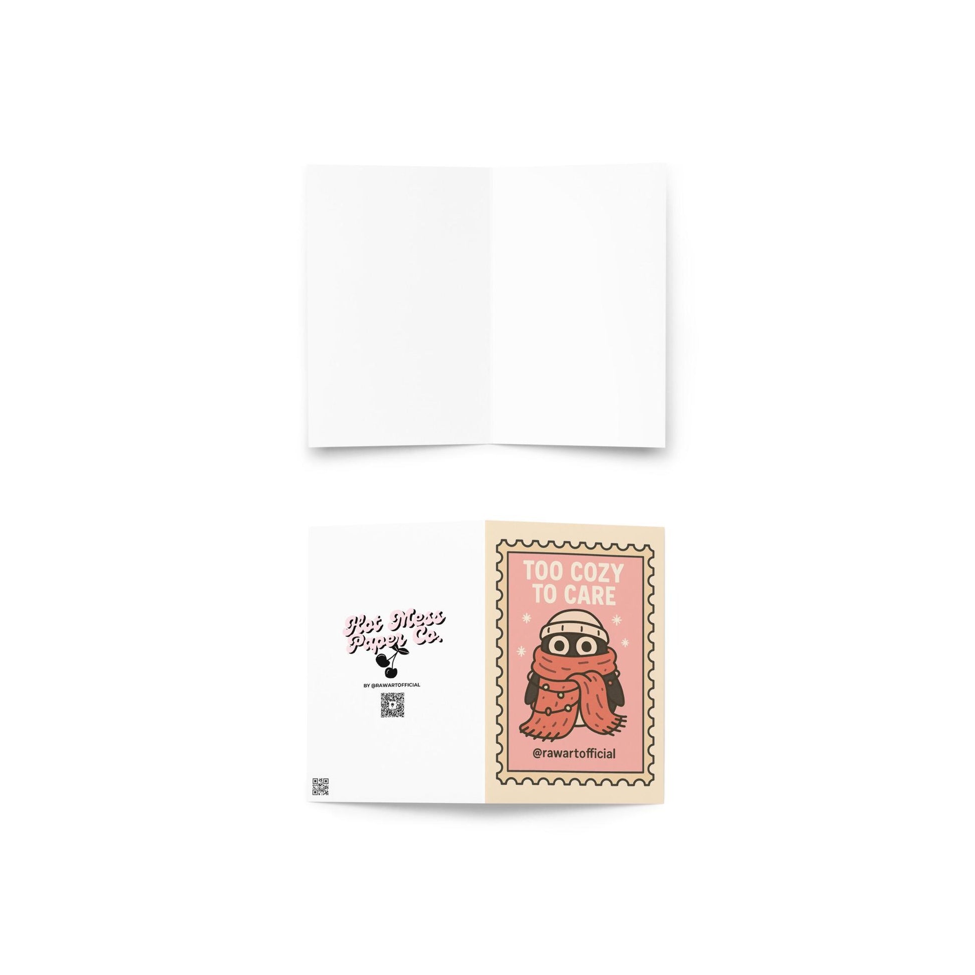 Stamp-style pink holiday card with bundled penguin wearing scarf and beanie, caption reads “Too Cozy To Care.”