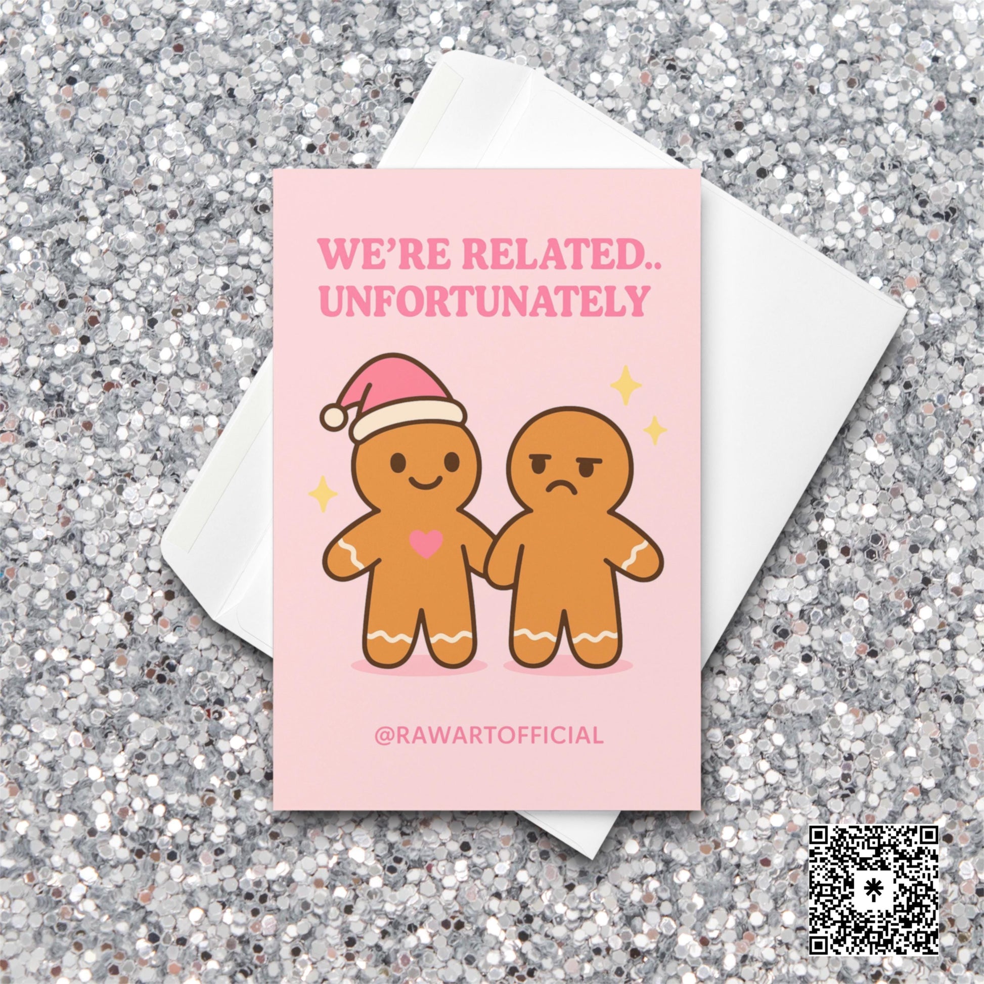 Pink gingerbread sibling Christmas card with one smiling and one annoyed.