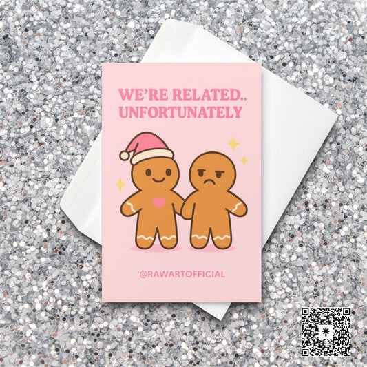 Pink gingerbread sibling Christmas card with one smiling and one annoyed.