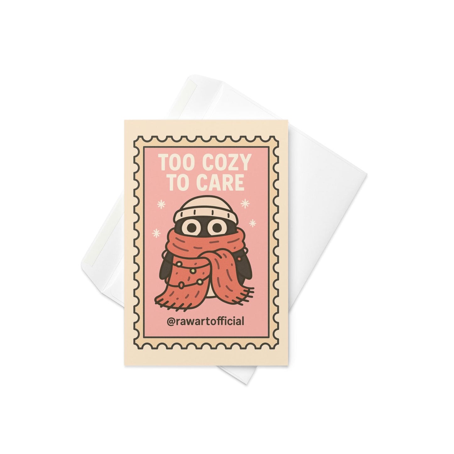 Stamp-style pink holiday card with bundled penguin wearing scarf and beanie, caption reads “Too Cozy To Care.”