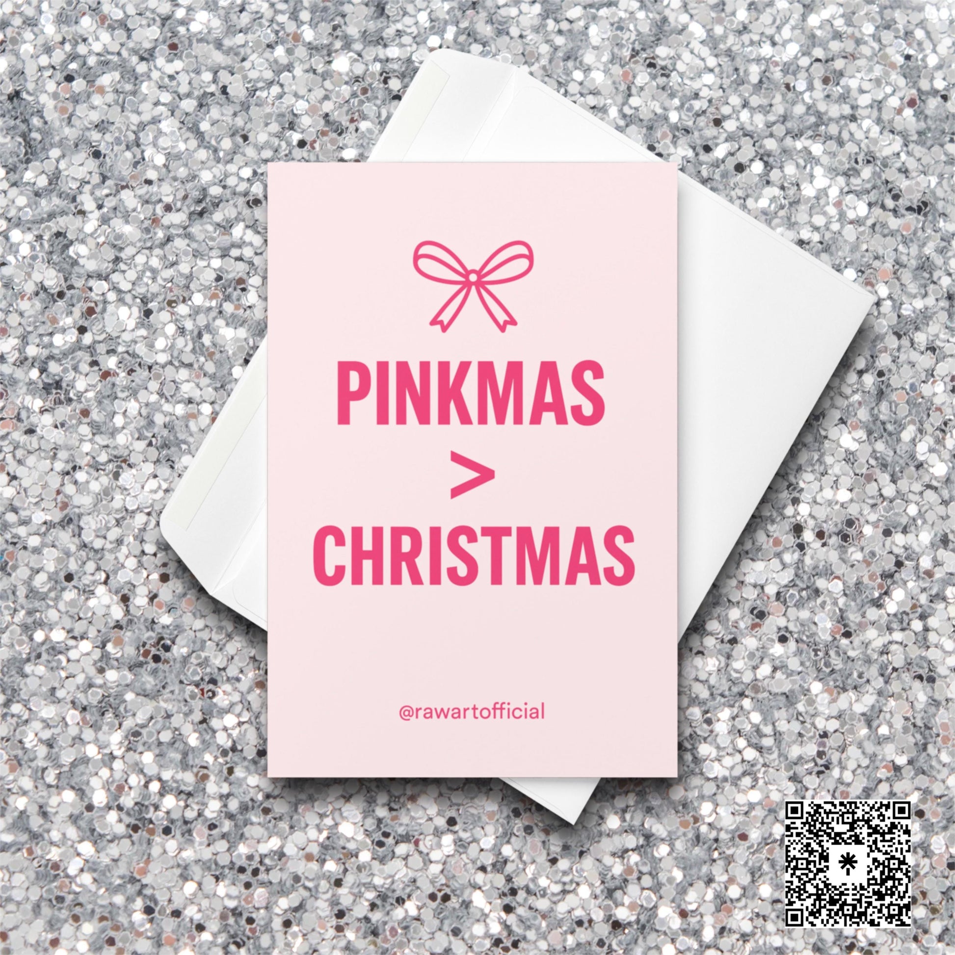 Pink card with bow icon and text “Pinkmas > Christmas” in bold hot-pink lettering.