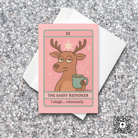 Sassy reindeer Christmas tarot card holding a mug on pink background.