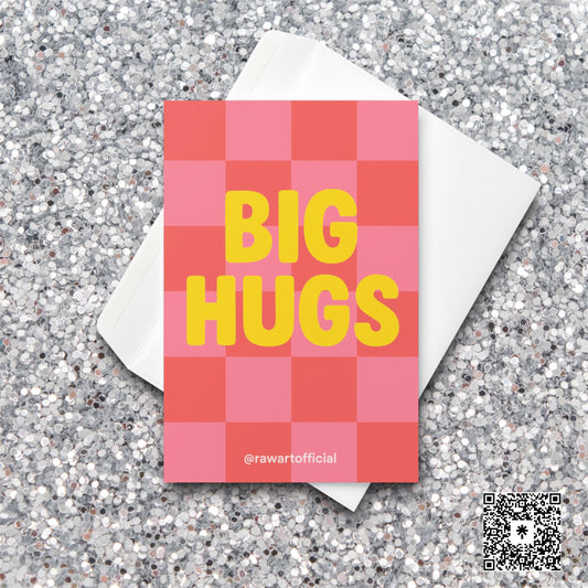 Pink and red checkered greeting card with bold yellow text that says “BIG HUGS.”