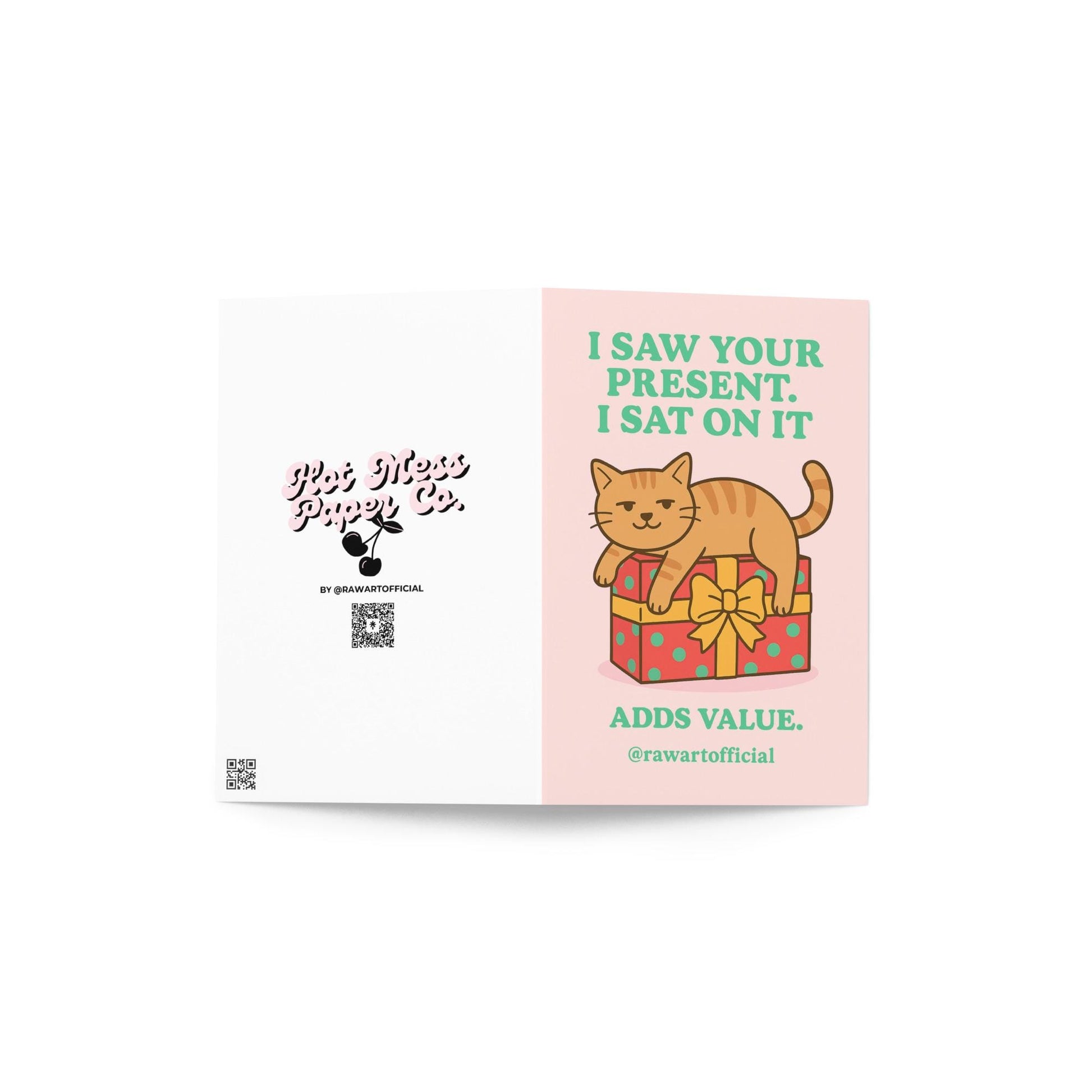 Orange cat sitting on a wrapped present with text “I Saw Your Present. I Sat On It.”