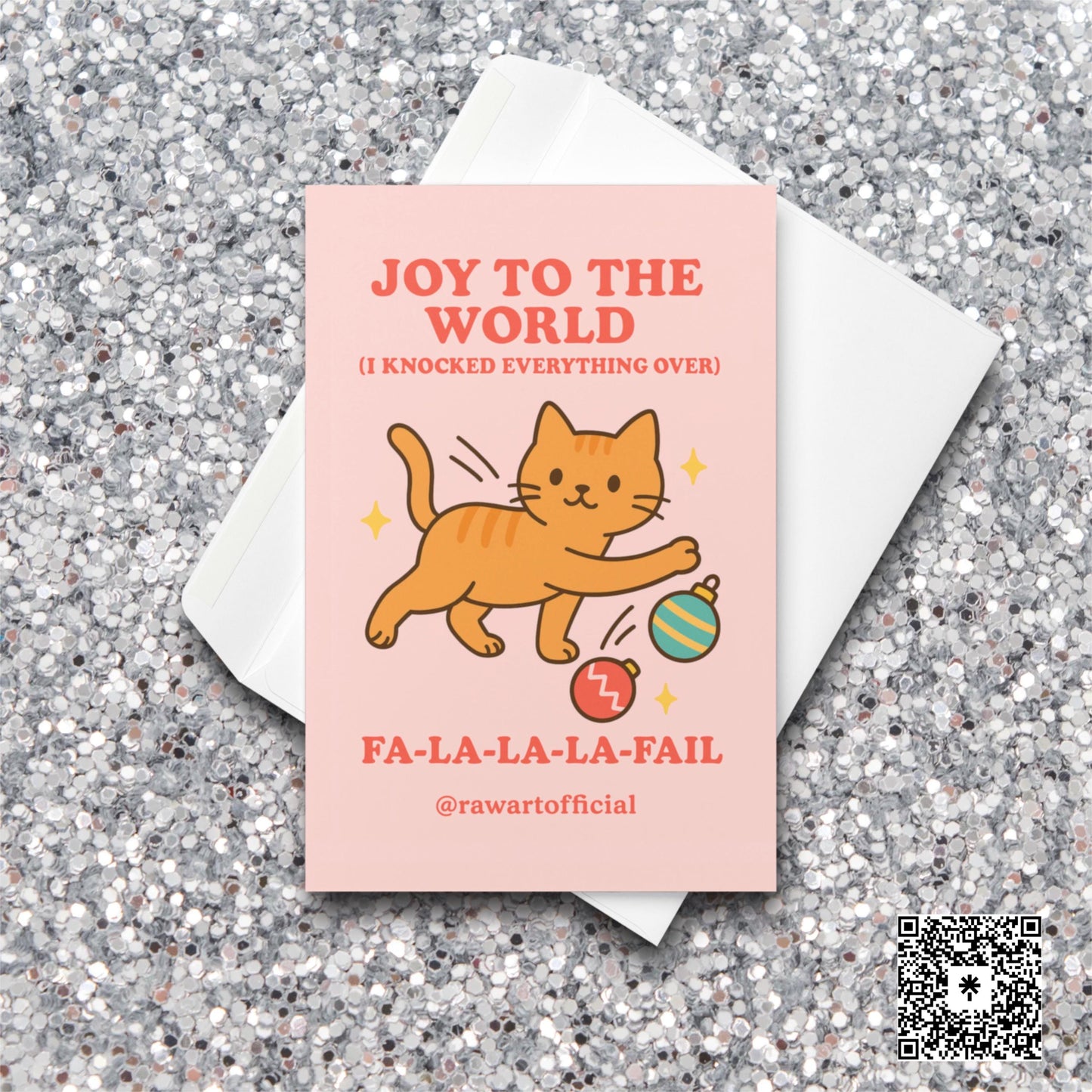 Orange cat batting ornaments with text “Joy to the World (I Knocked Everything Over).”