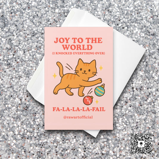 Orange cat batting ornaments with text “Joy to the World (I Knocked Everything Over).”