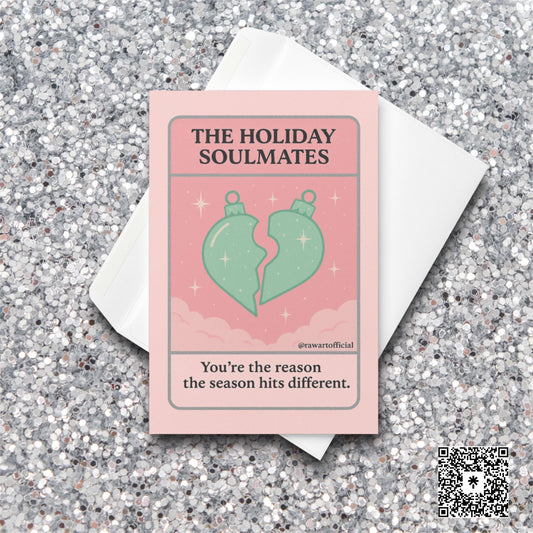 Pink tarot-style card with two ornament halves forming a heart and text “The Holiday Soulmates.”