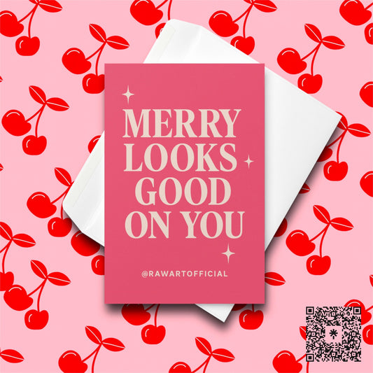 Pink card with retro cream text reading “Merry Looks Good on You” with sparkly accents.