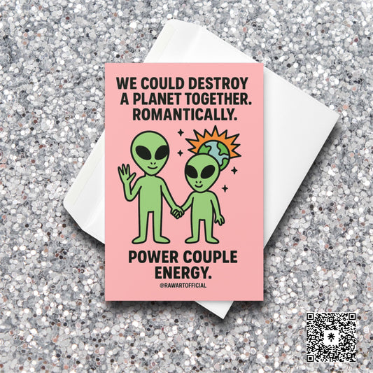 Alien couple holding hands with a tiny exploding planet behind them on a pink background. Text says “We could destroy a planet together. Romantically.” Funny Valentine card.