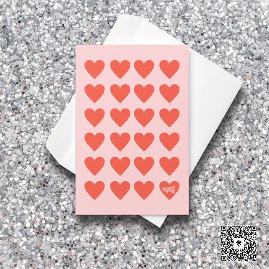 Pink card with repeating red heart pattern and one heart signed @rawartofficial.