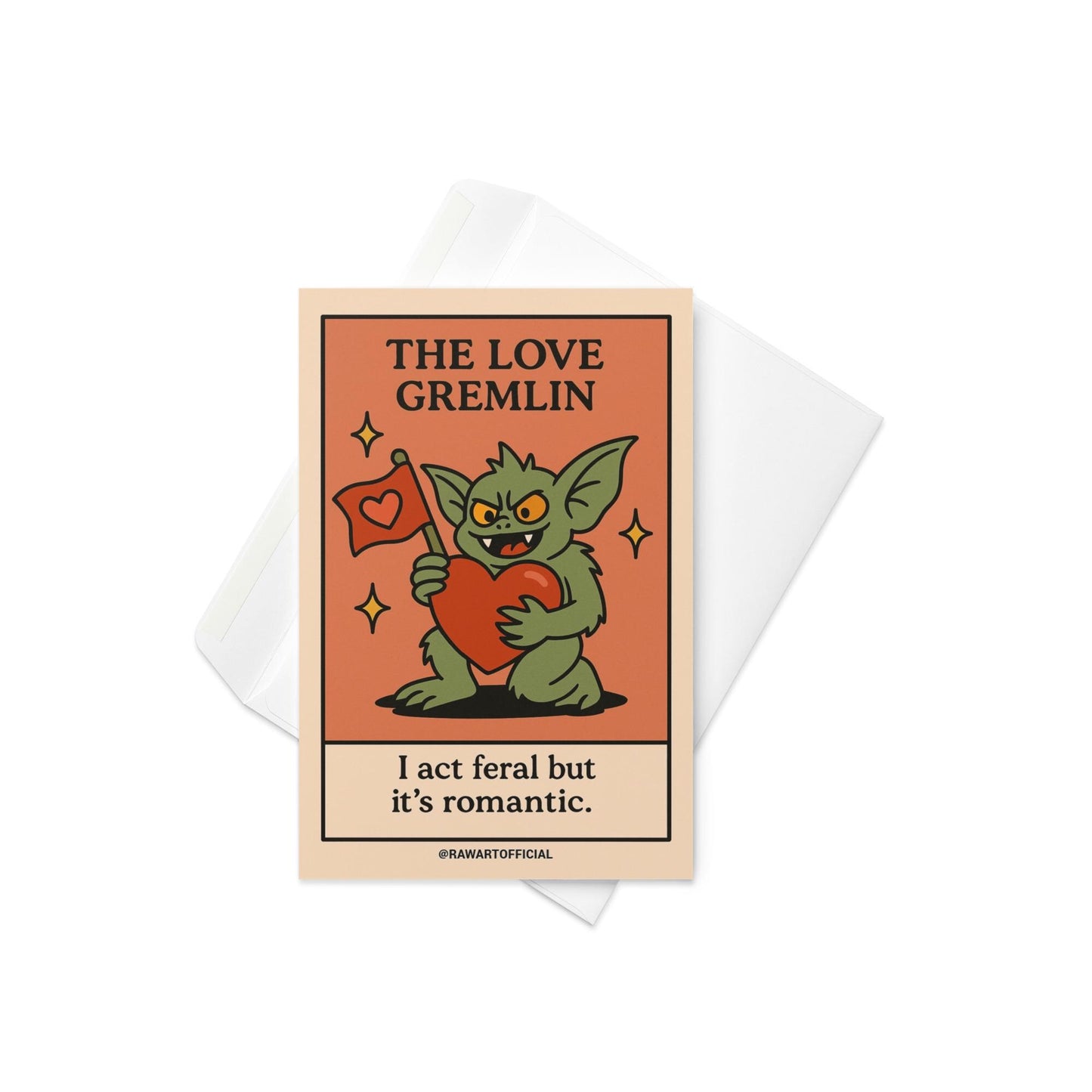 Green gremlin holding a big red heart and love flag with the phrase “I act feral but it’s romantic.”