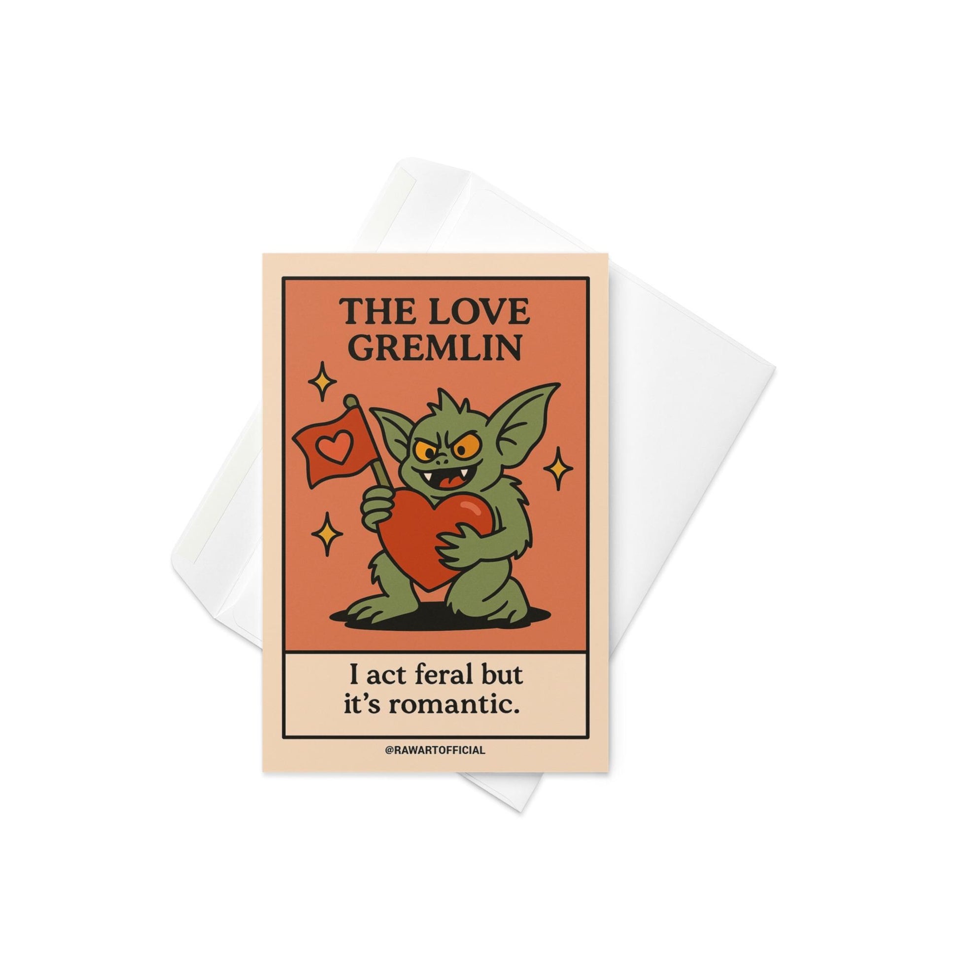 Green gremlin holding a big red heart and love flag with the phrase “I act feral but it’s romantic.”