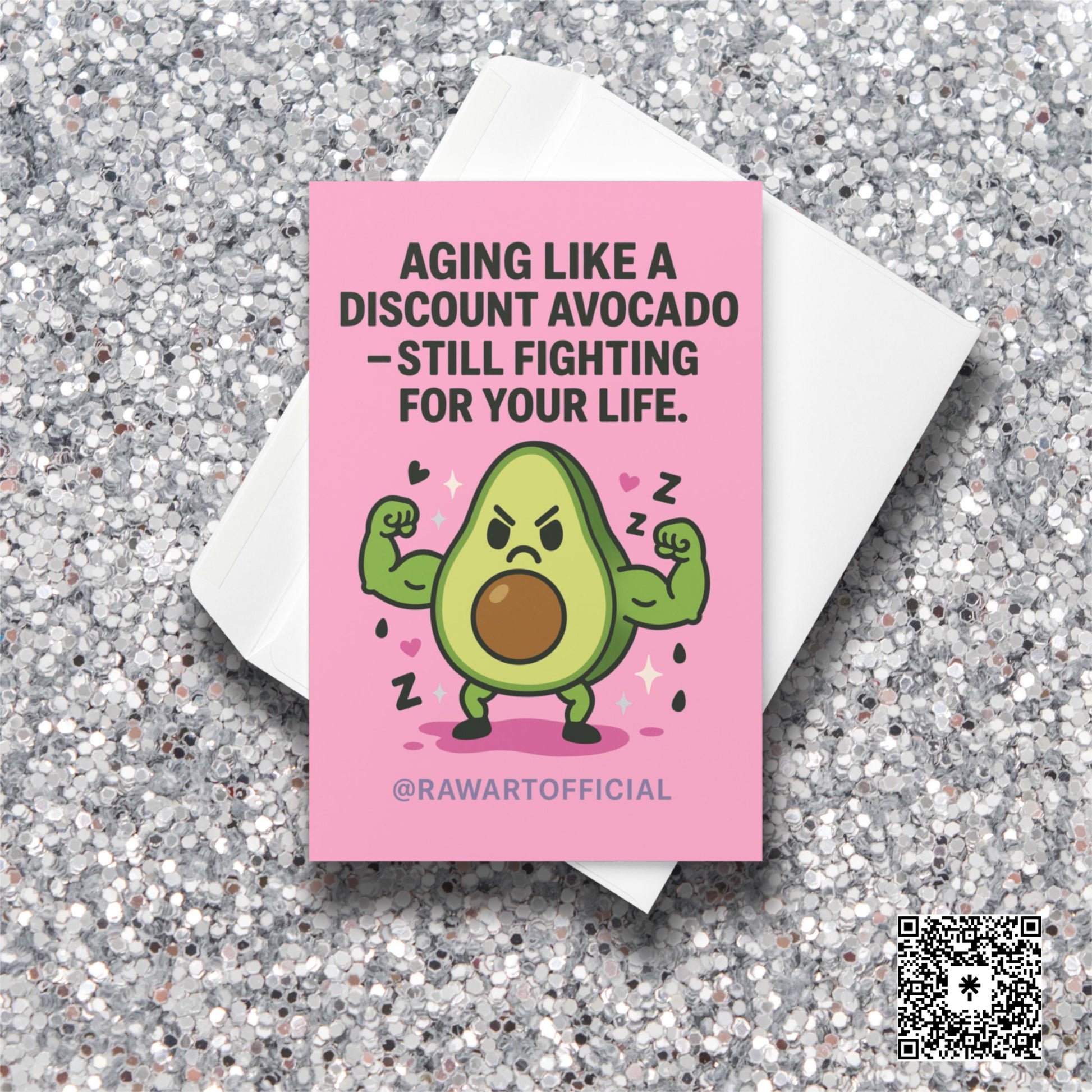 “Funny avocado birthday card featuring a muscular cartoon avocado flexing with a grumpy face on a pink background, illustrated by @rawartofficial.”