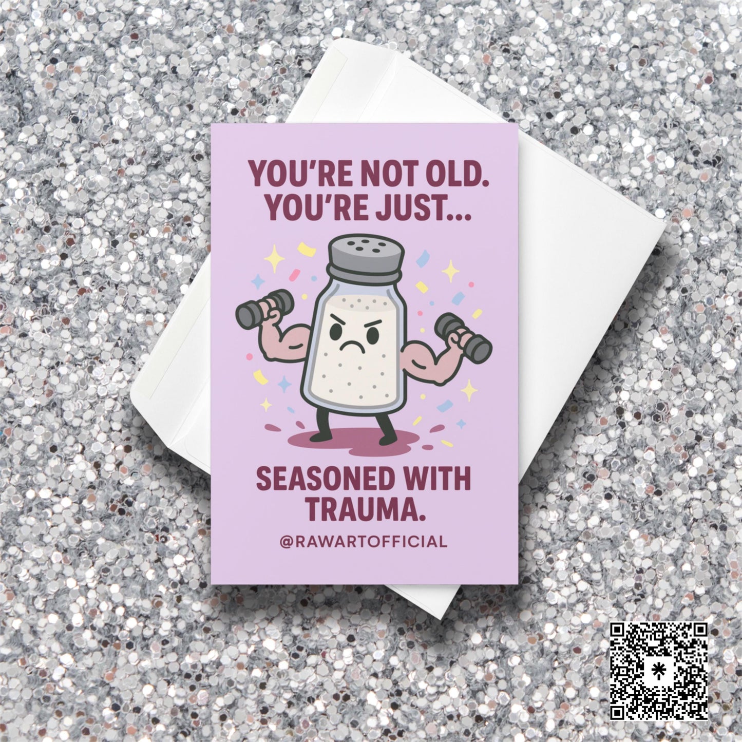 Buff salt shaker lifting weights with confetti and text: “You’re not old, just seasoned with trauma.”
