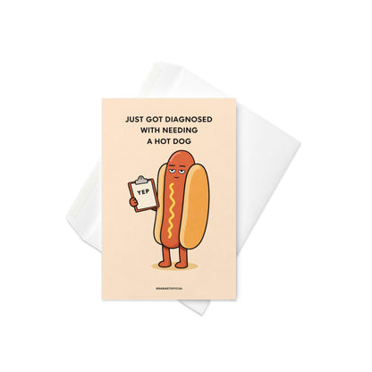 Funny hot dog greeting card with cartoon hot dog holding clipboard and text just got diagnosed with needing a hot dog