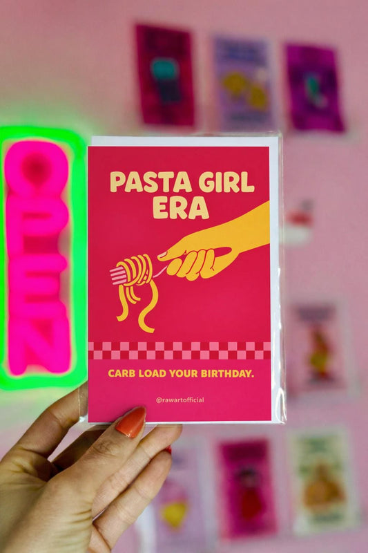Red birthday card with the phrase “Pasta Girl Era” featuring a hand twirling spaghetti on a fork and the text “Carb Load Your Birthday.”