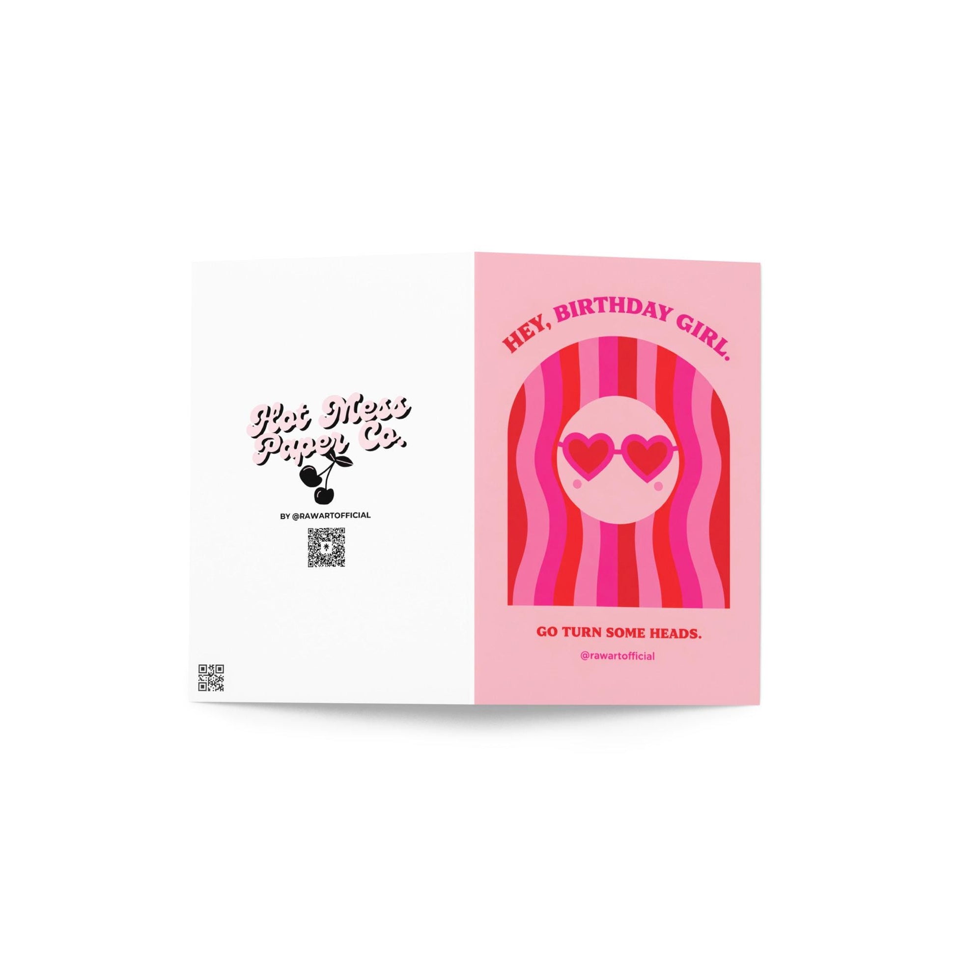 Pink birthday card featuring a girl with wavy red and pink hair and heart-shaped sunglasses with the phrase “Hey, Birthday Girl. Go Turn Some Heads.”