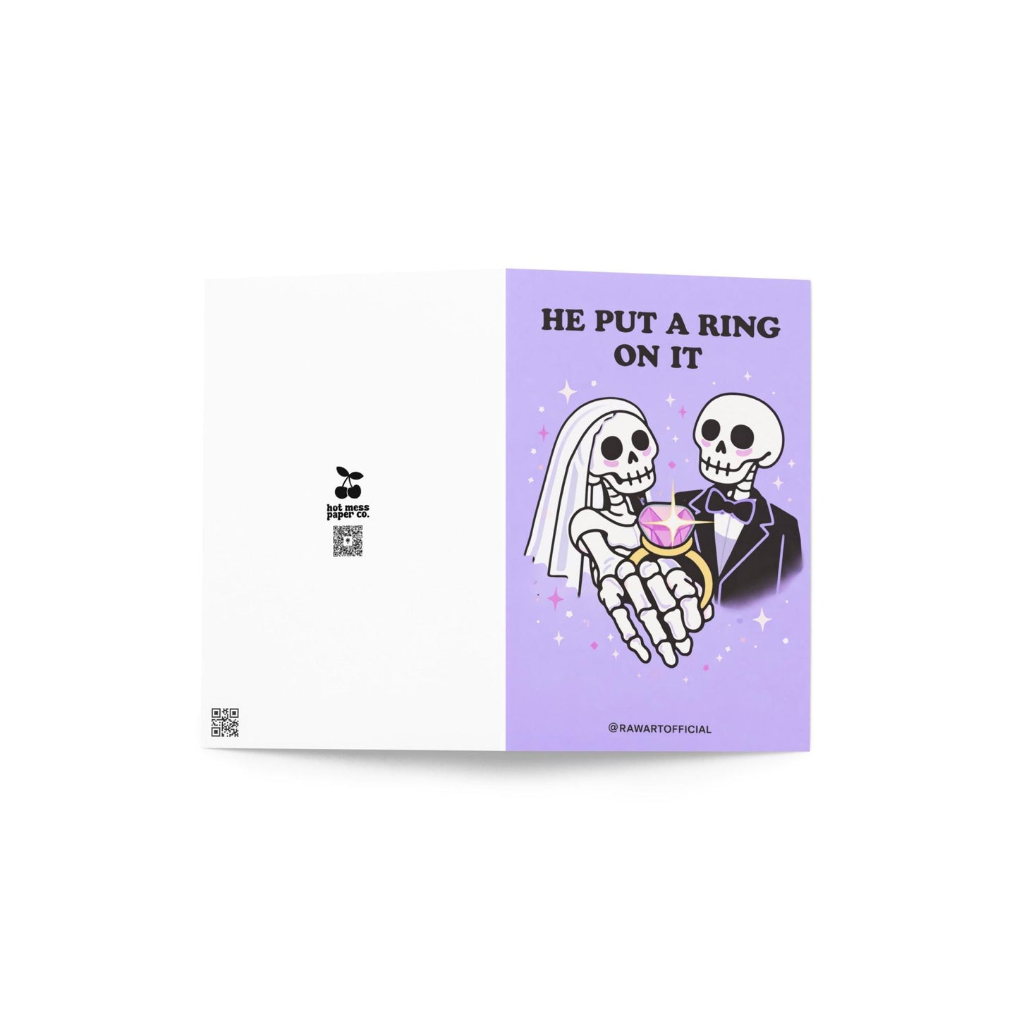 Lavender wedding card featuring skeleton bride and groom holding a large pink gemstone ring with text “He Put a Ring On It.”