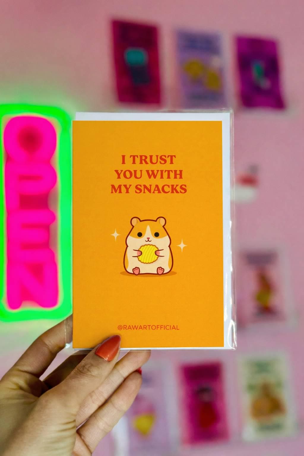 Funny love card featuring a cute hamster holding a chip with text “I trust you with my snacks” on a yellow background