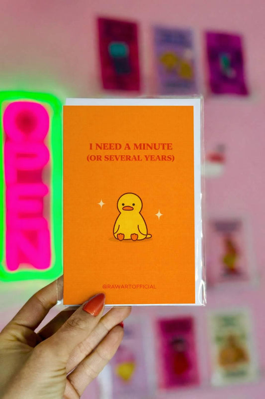 Funny burnout card featuring a small duck with text “I need a minute or several years” on a bold orange background