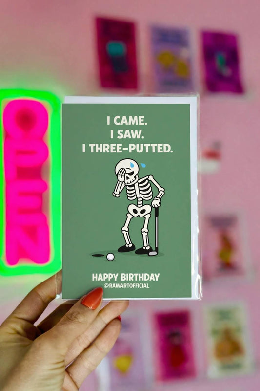 Funny golf birthday card with skeleton facepalming and text “I came I saw I three putted” on green background