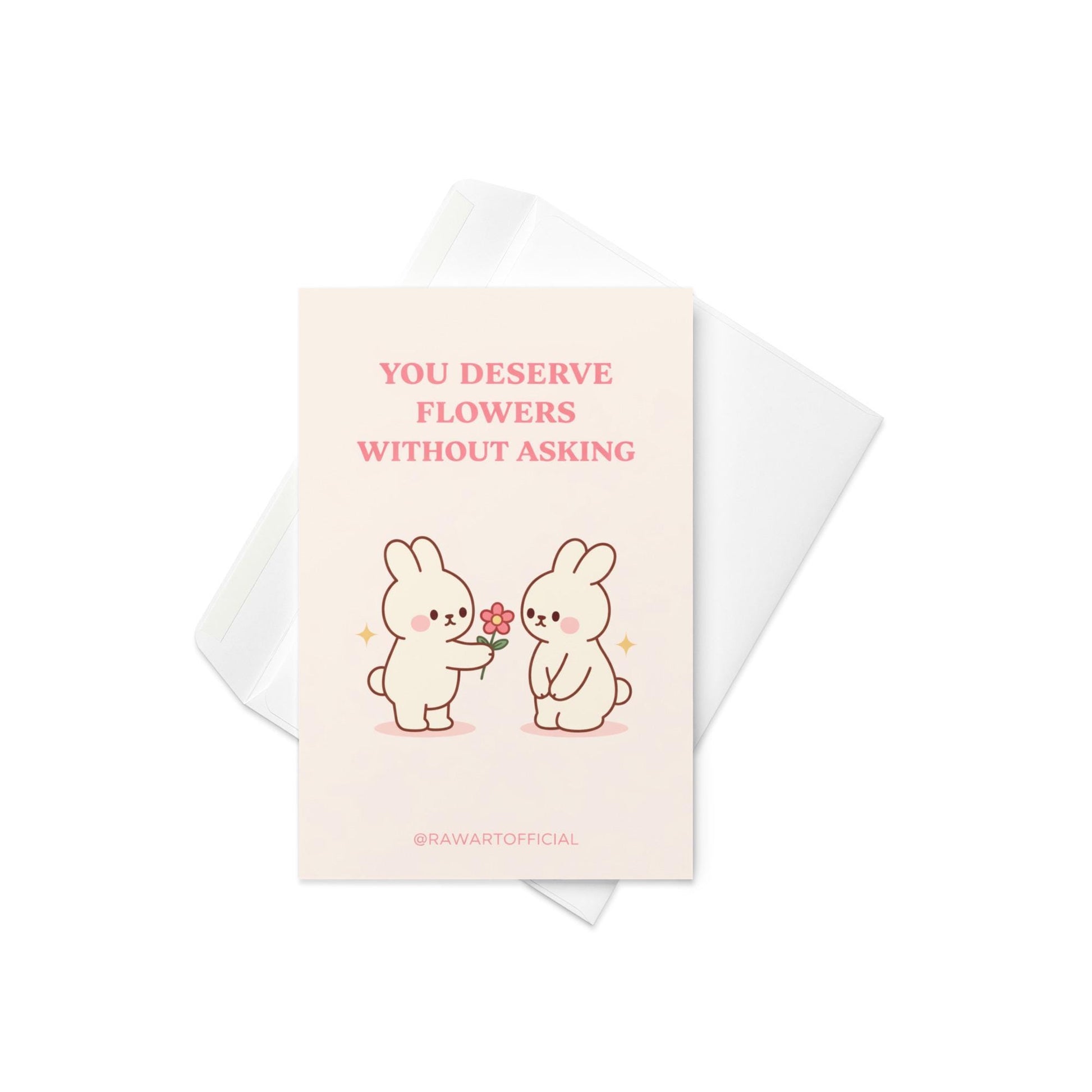 Romantic bunny greeting card with text “You deserve flowers without asking” on cream background