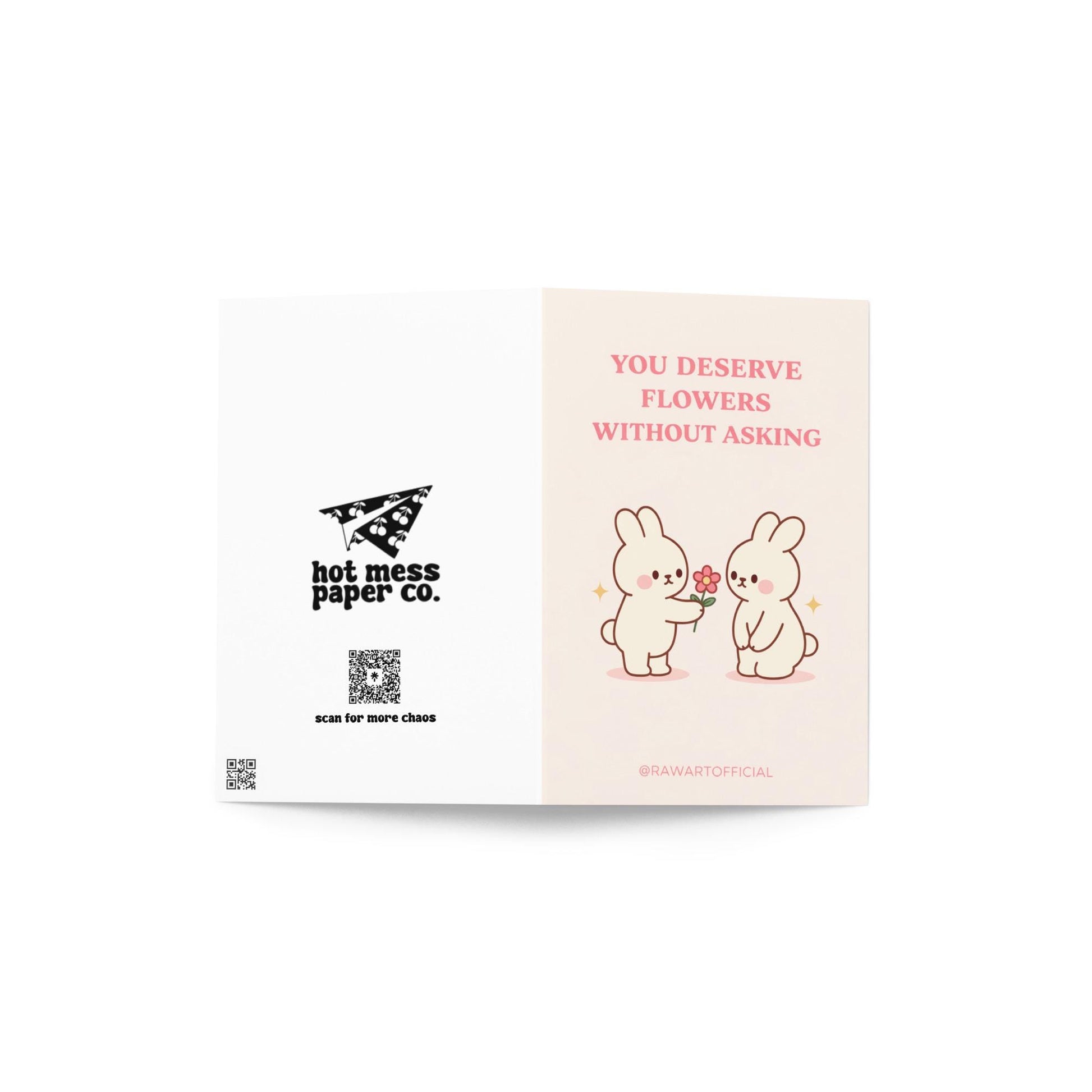 Romantic bunny greeting card with text “You deserve flowers without asking” on cream background