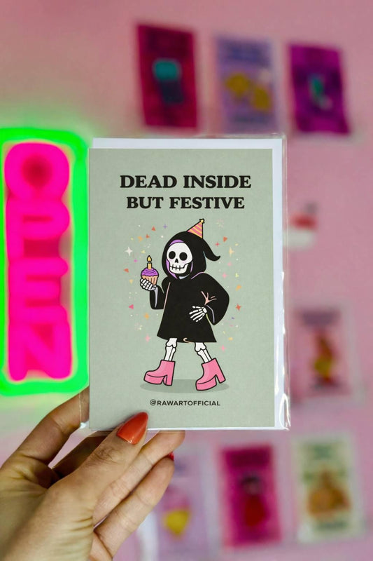 Spooky greeting card with text “Dead inside but festive” on light background with minimalist Halloween style