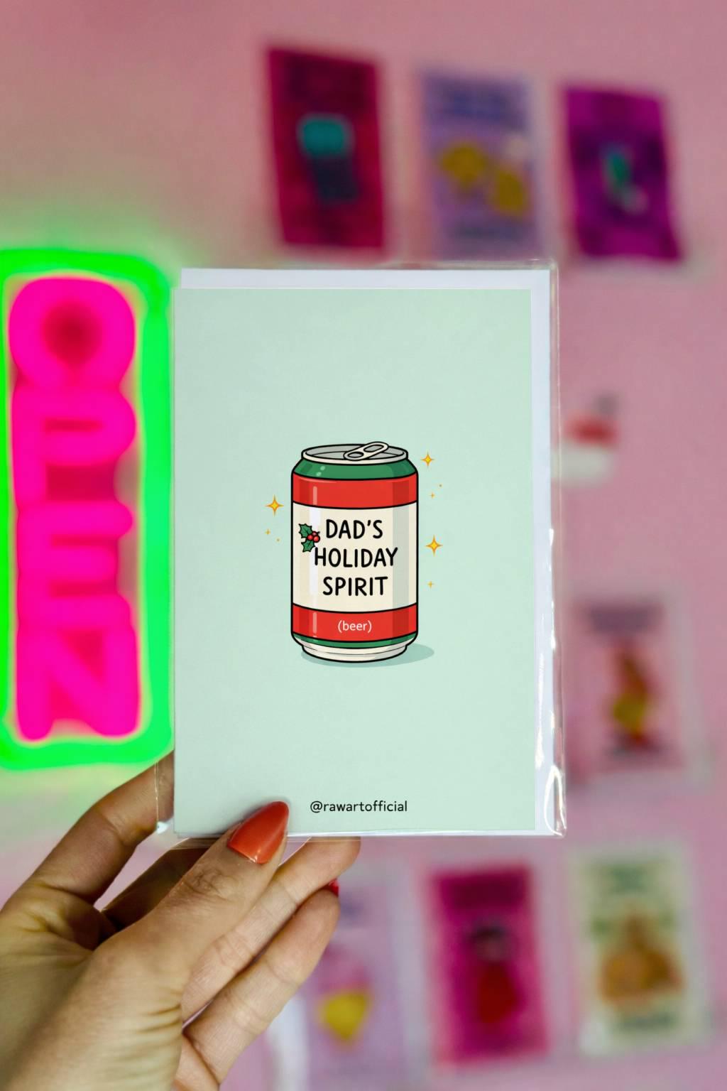 Funny Christmas card for dad featuring a beer can labeled “Dad’s Holiday Spirit” on a light blue background